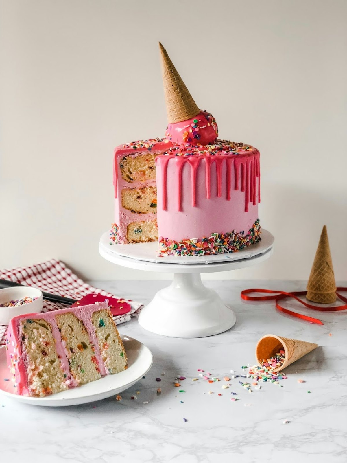 Pink drip birthday cake with sprinkles