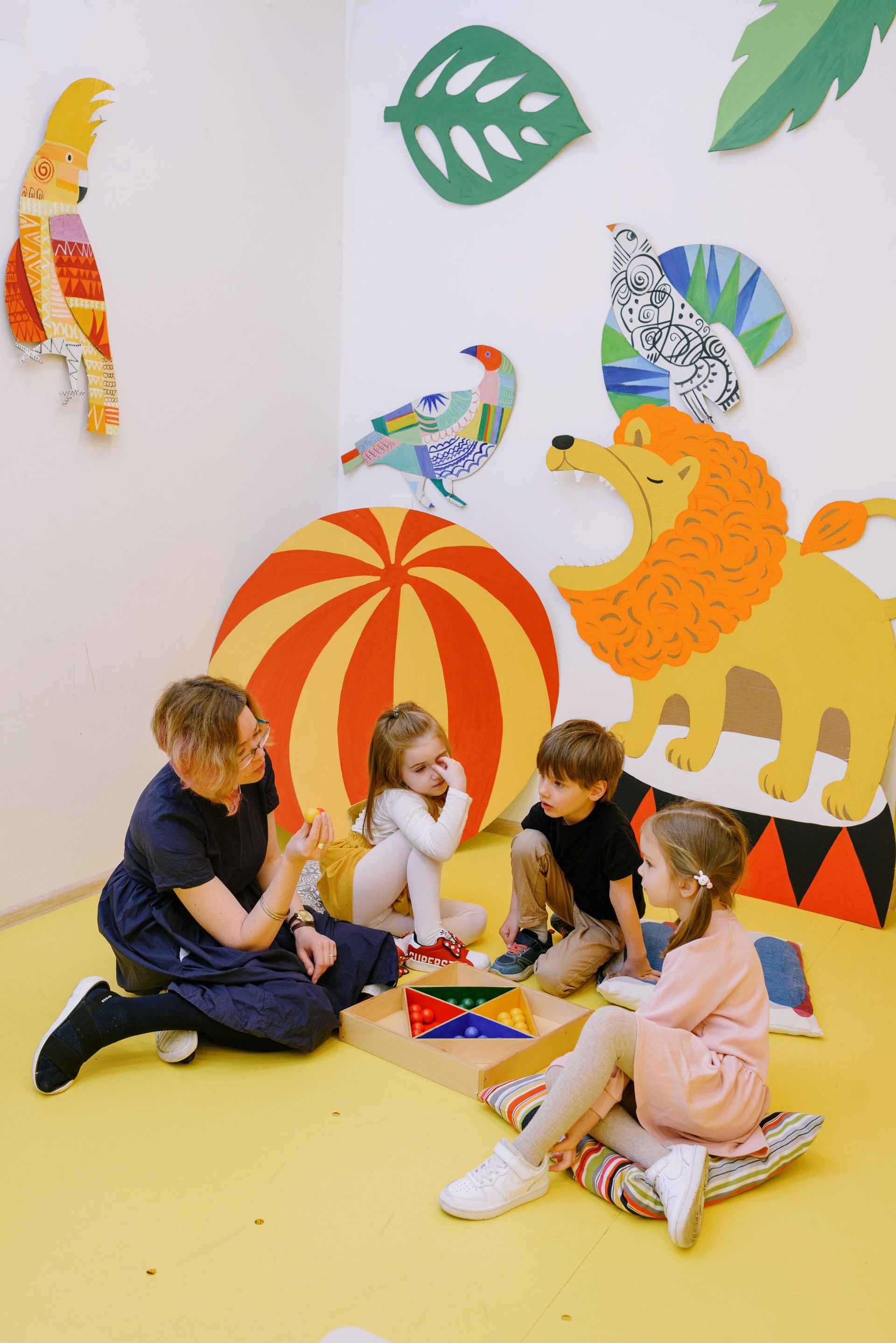 Teacher and children playing together at Dromina Community Playschool