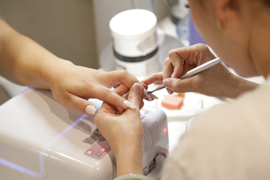 Nail technician applying gel polish at ROYAL Nails & Beauty