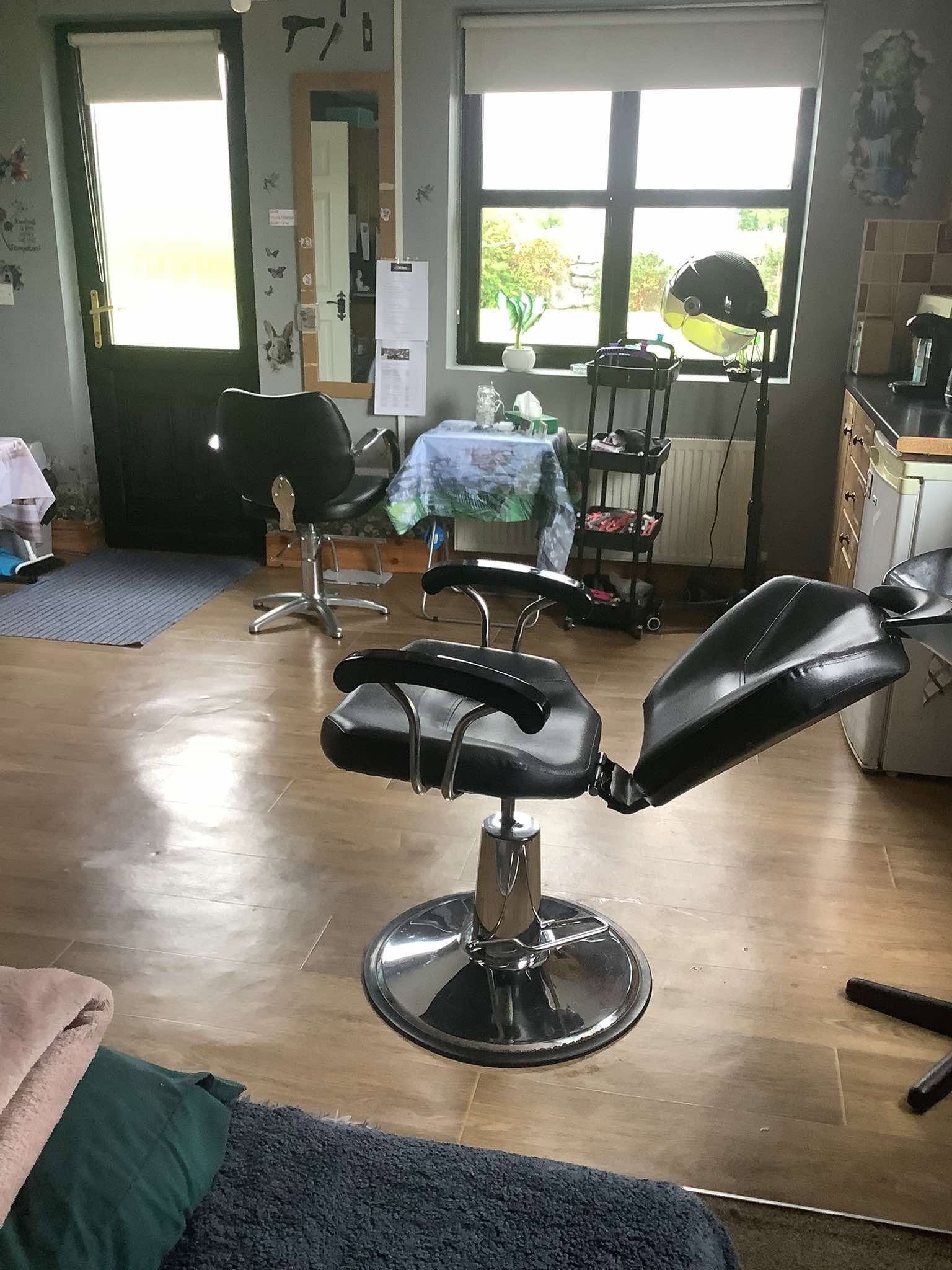 Hair styling chair and dryer at A Cut in the Meadows
