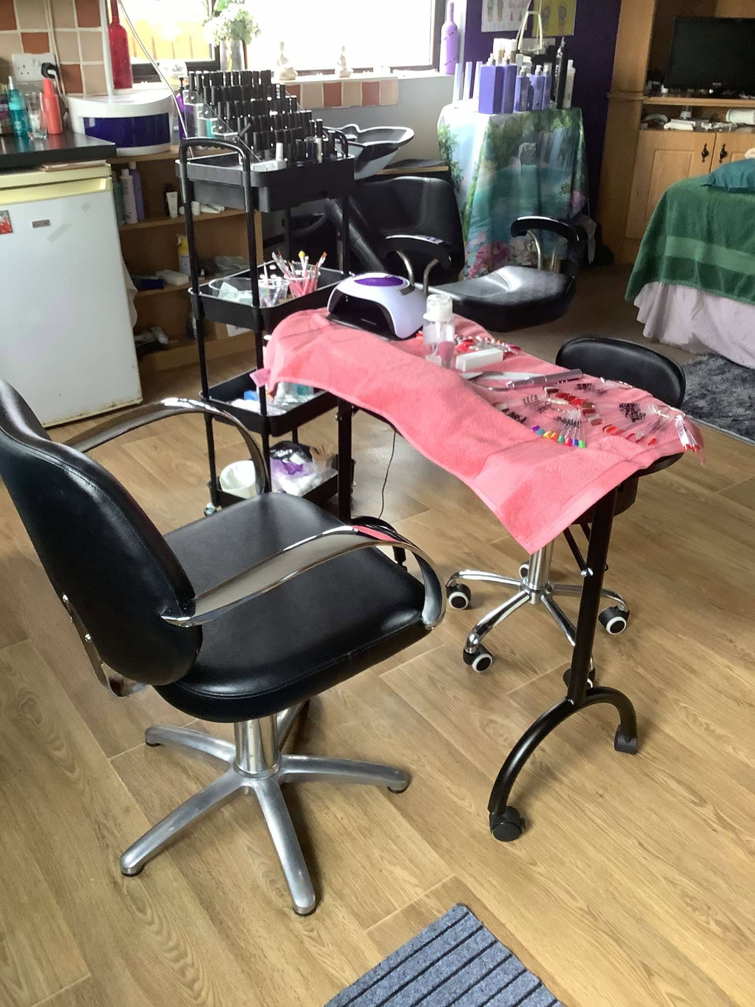 Nail station set up with polish trolley and UV lamp